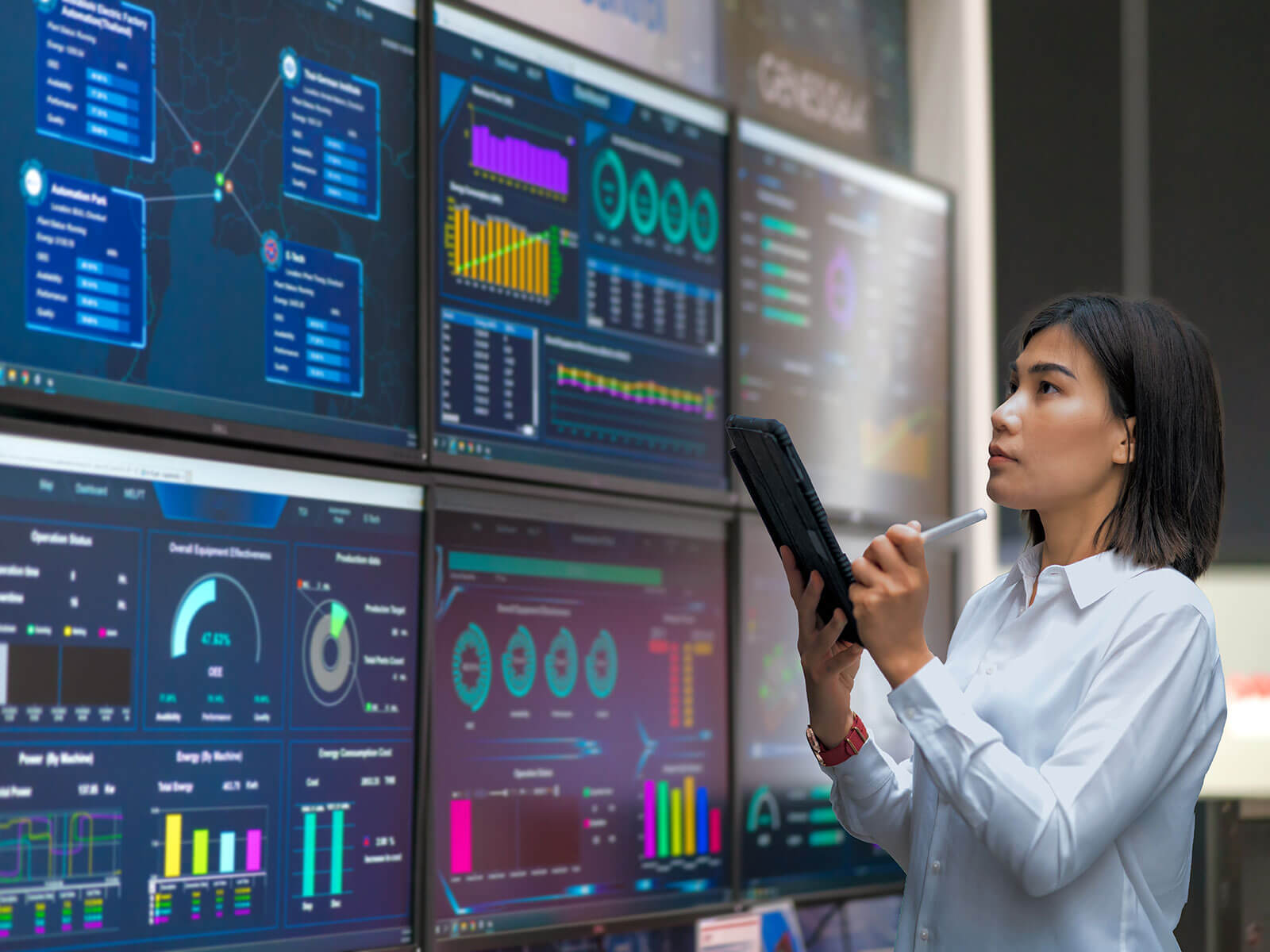 Asian woman monitoring cloud automation process status on a tablet and screen