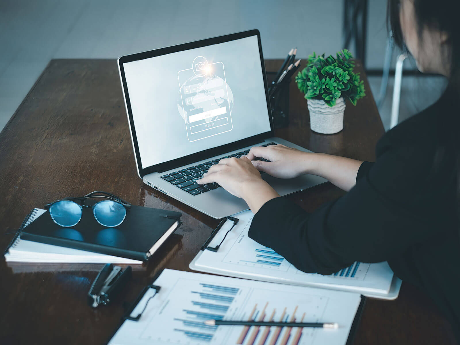 Businesswoman performing secure login on an app, highlighting authentication practices in DevSecOps