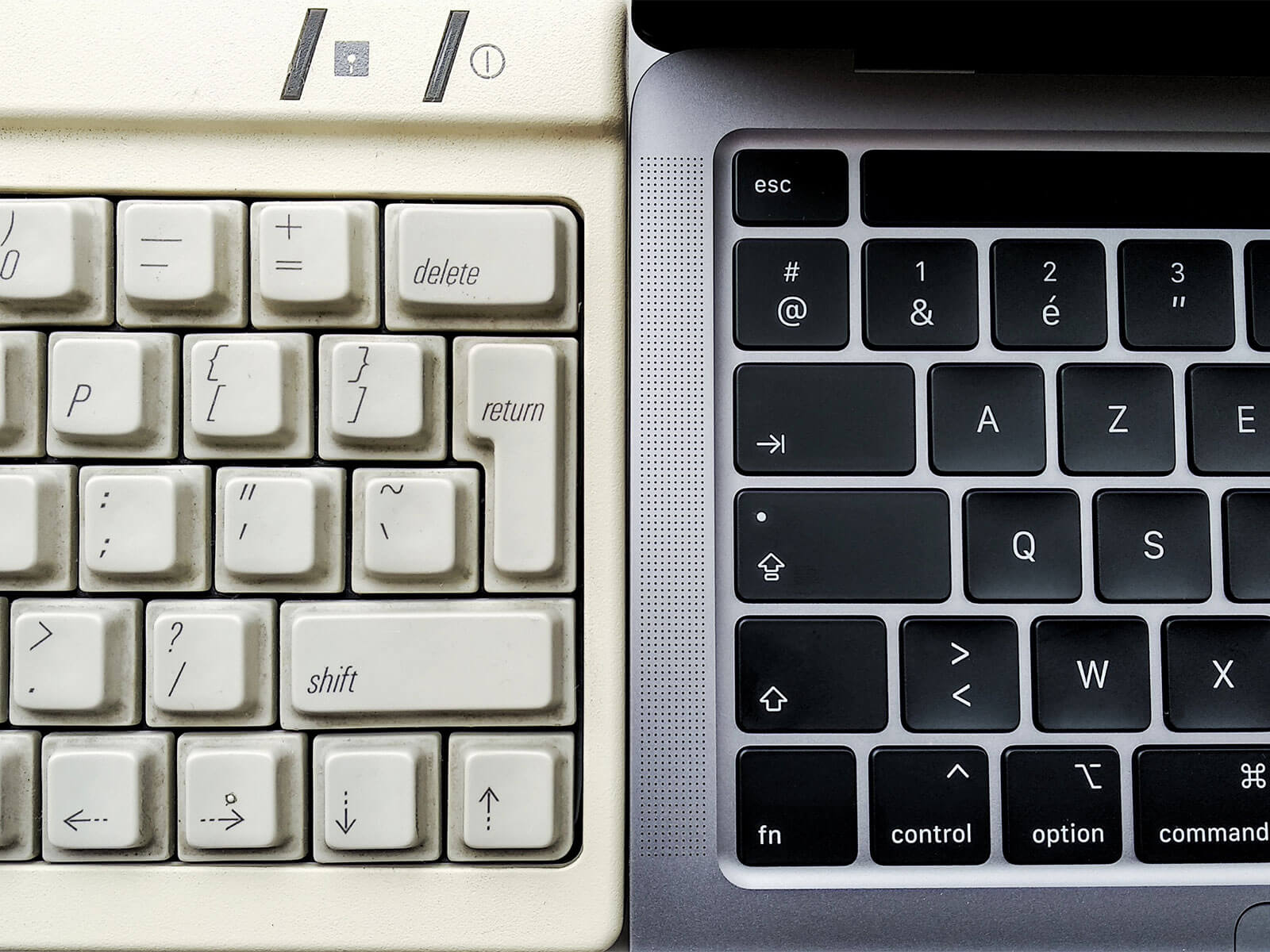 Contrast between an old vintage computer and a modern laptop, representing the transition from legacy systems to modern technologies