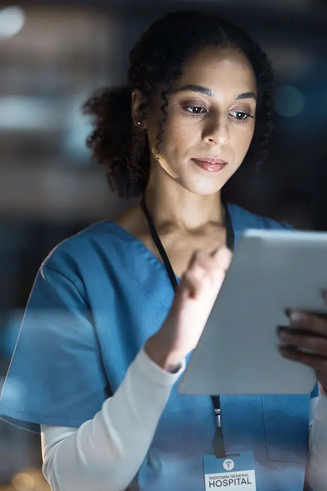 Healthcare professional using a smart tablet