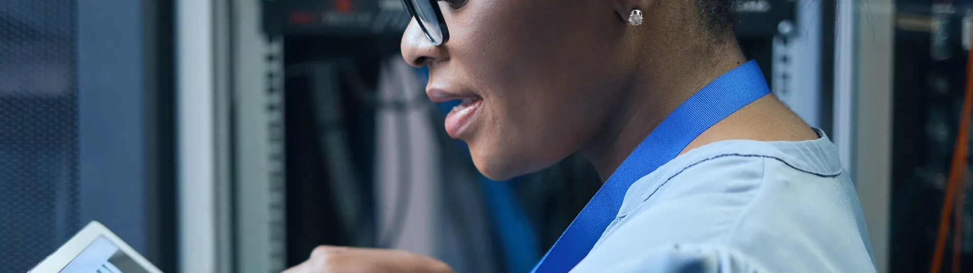 IT operations engineer using tablet to manage servers in data center