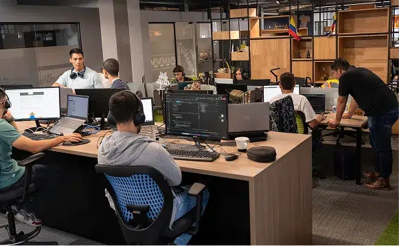 Engineers working collaboratively in open office