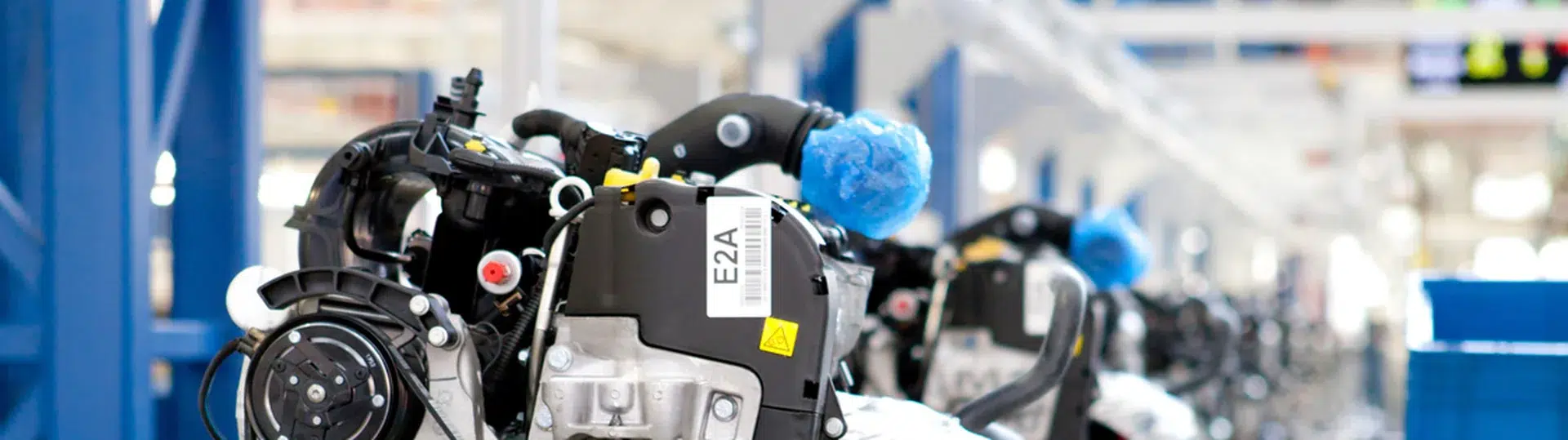 Automotive engines on a modern factory assembly line representing operational modernization