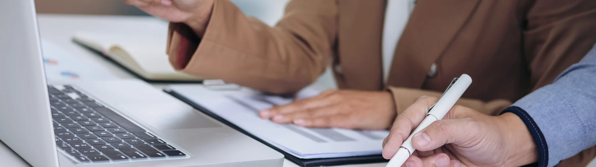 Business professionals reviewing performance reports and charts