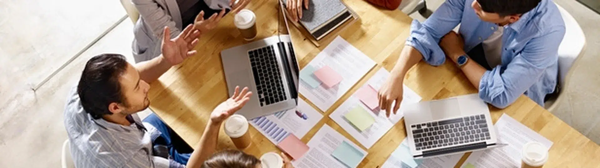 Business team overhead view collaborating on agile project planning