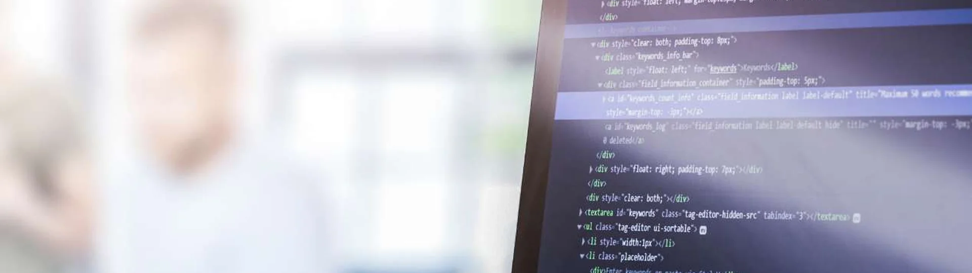 Developer coding scalable cloud infrastructure solutions