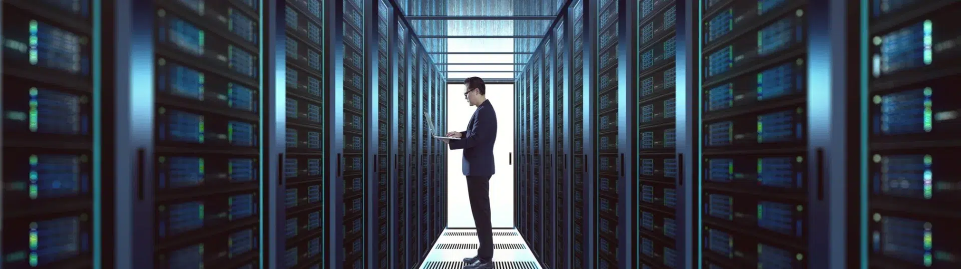 IT professional managing enterprise infrastructure in a data center server corridor representing GAP's technical depth