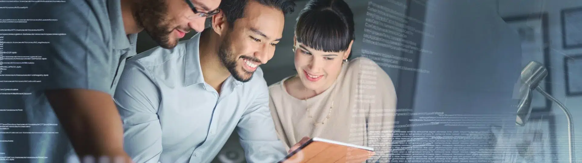 Nearshore engineering team collaborating on a tablet with code overlay in a modern tech workspace