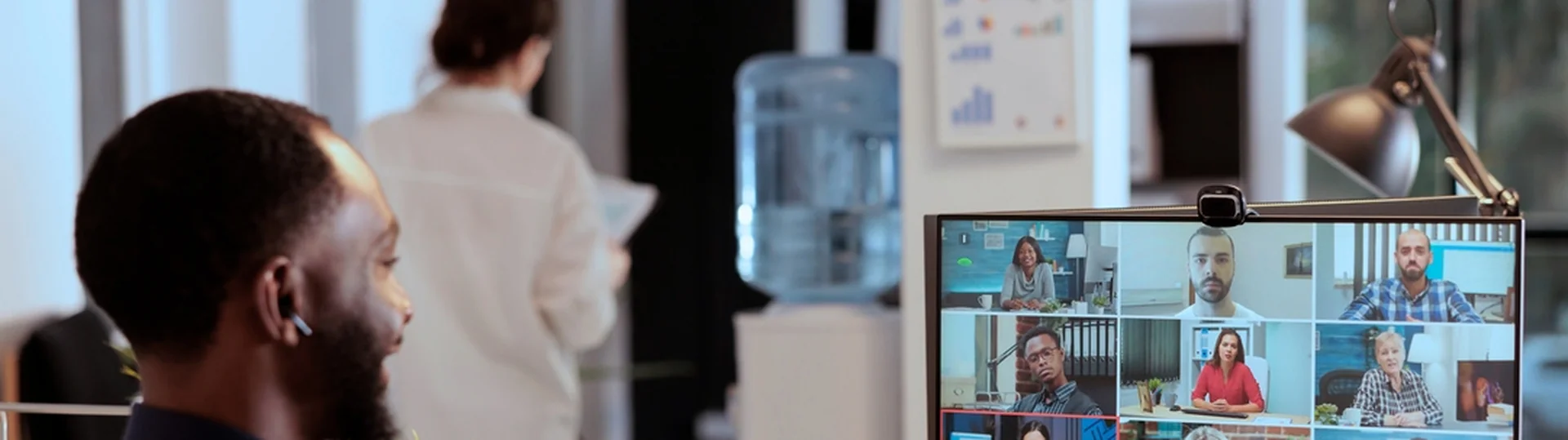 Professional collaborating with a remote nearshore team via video conference across multiple time zones