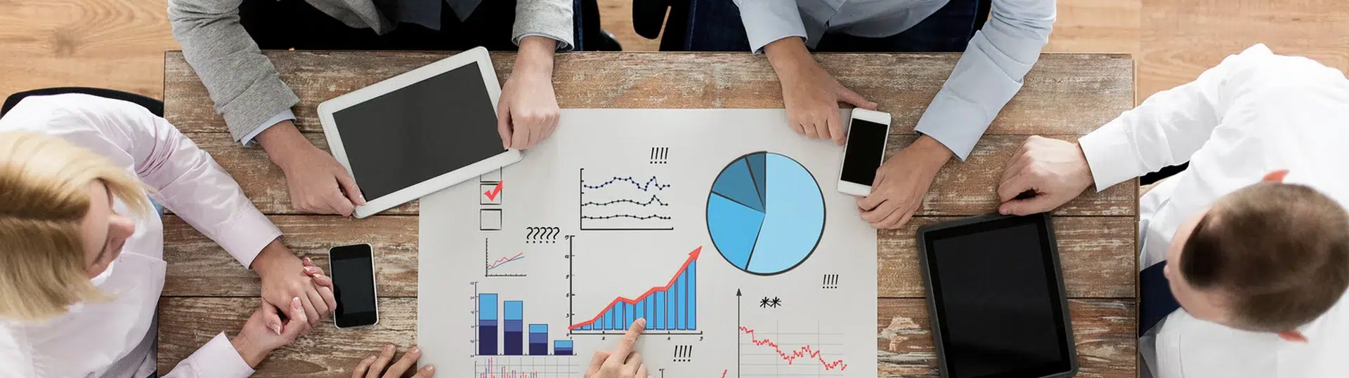 Team reviewing analytics charts and data during a project meeting